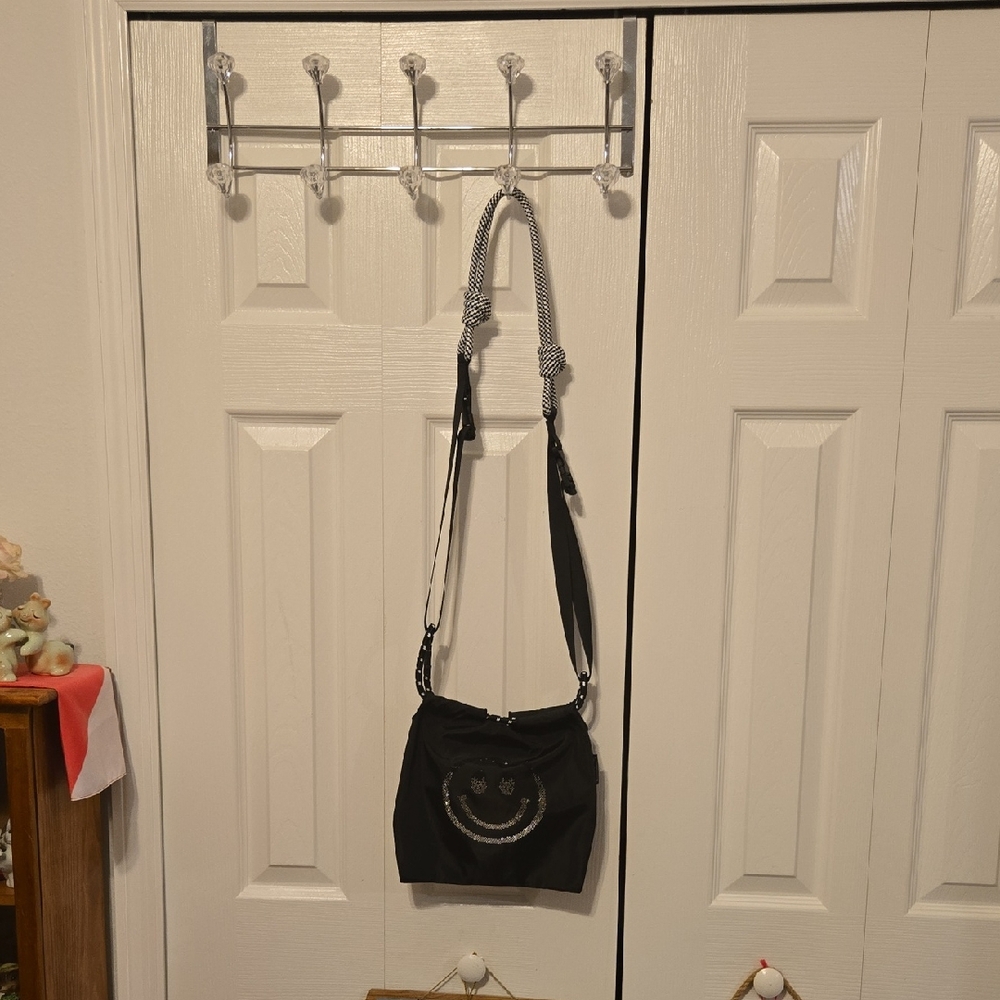 Chic Black Crossbody Bag with Smiley Accent